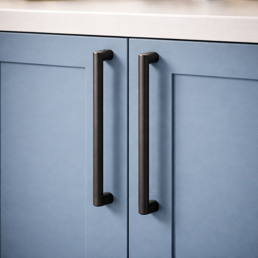 Blue cabinet doors with black handles in a kitchen setting