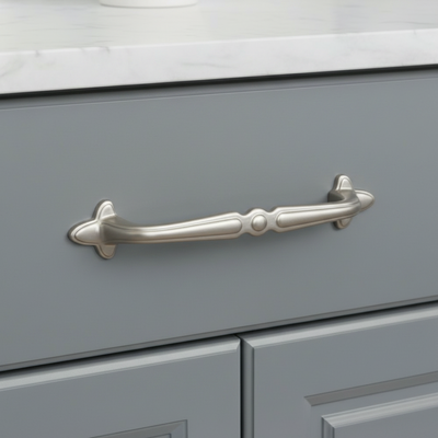 satin nickel cabinet handle on a gray drawer