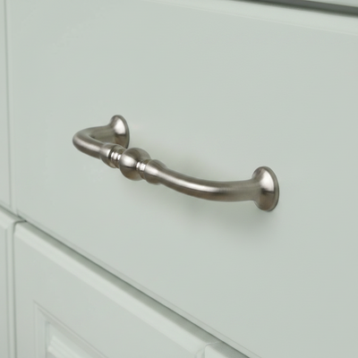 satin nickel cabinet drawer and door handle on a warm mint green drawer 