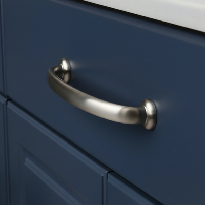 satin nickel handle on a blue cabinet door