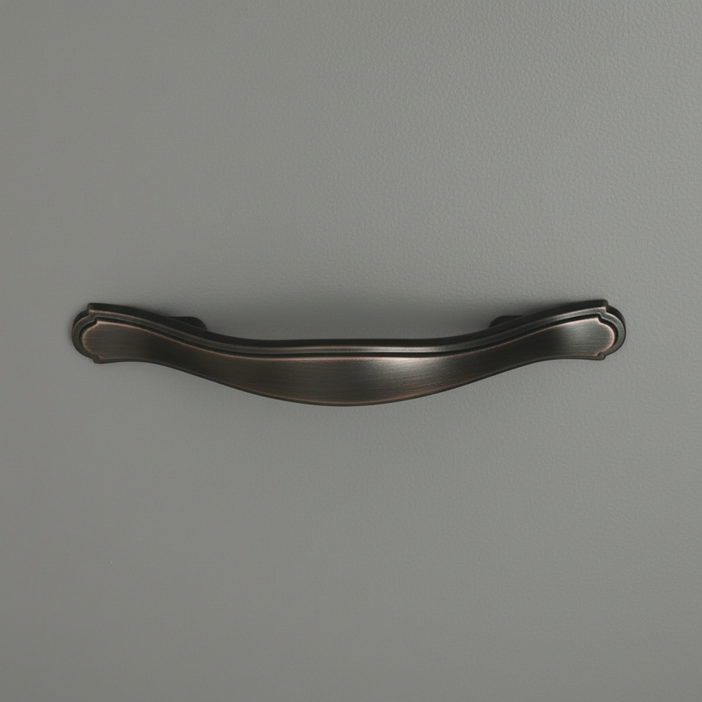 oil rubbed bronze cabinet pull on a gray drawer 