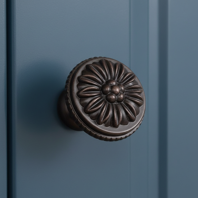 Decorative door knob on a blue door