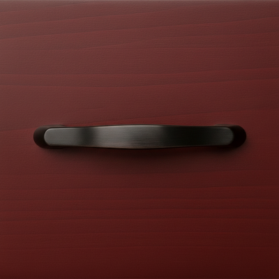 oil rubbed bronze handle on an oxblood cabinet drawer 