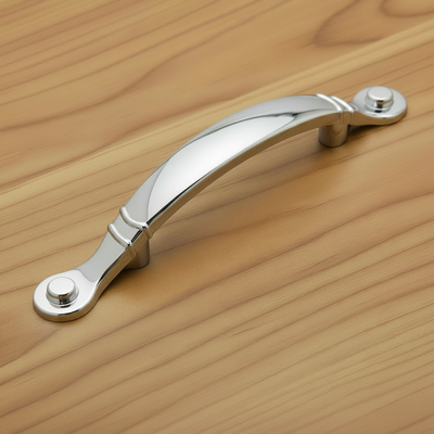 Chrome cabinet handle on a white background