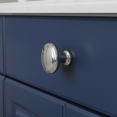 shiny cabinet knob on a drawer that is blue