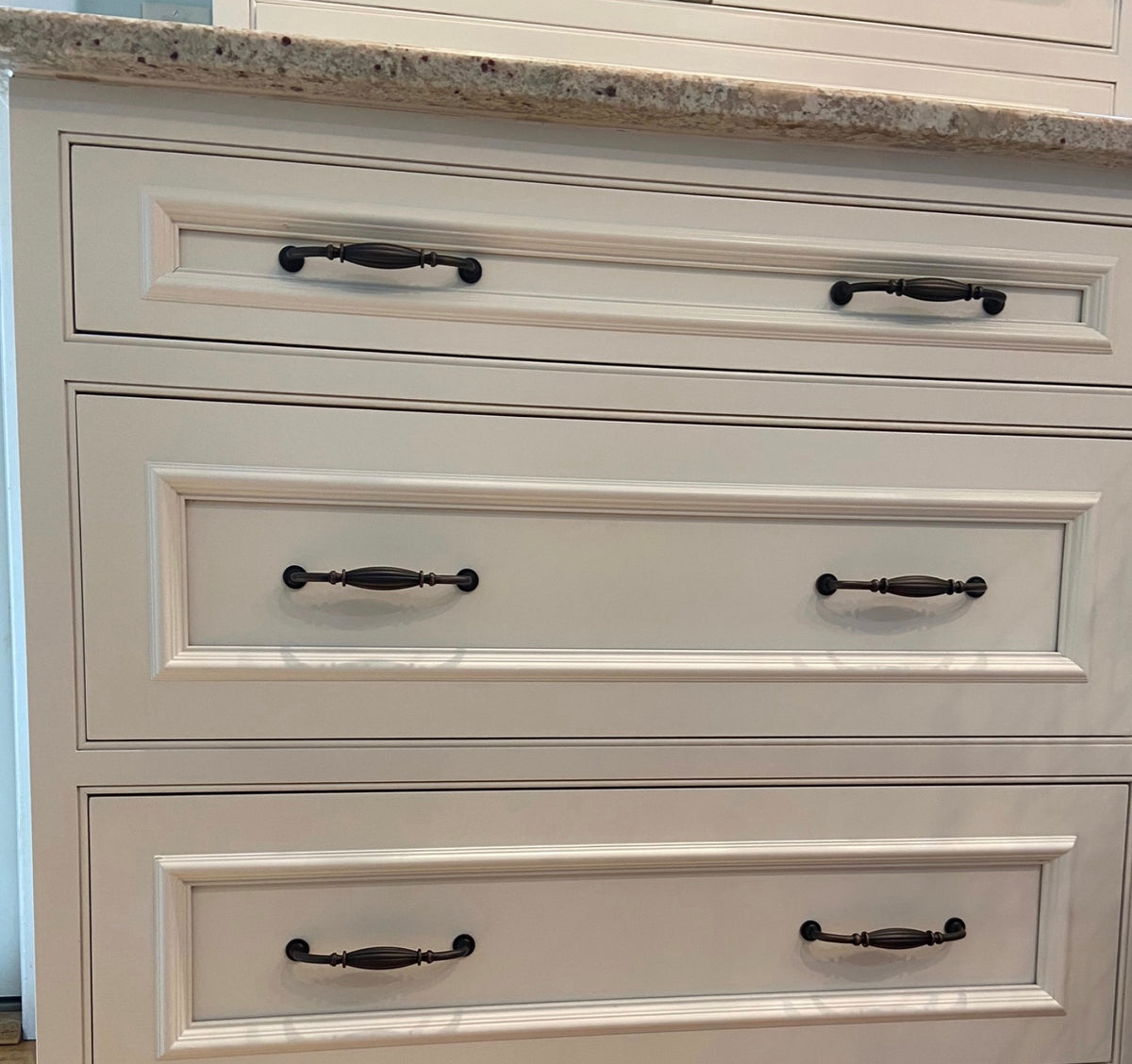 Cosmas 7120ORB on white drawers