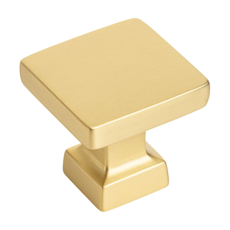 Gold cabinet knob on a white background