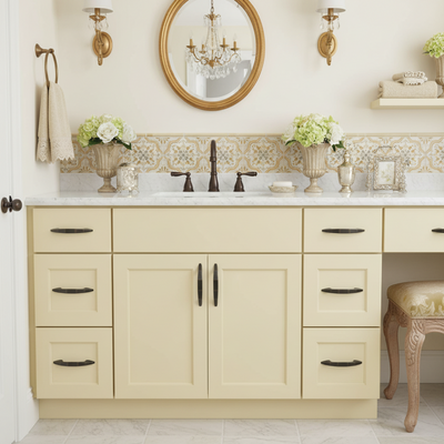 Metallic handle on a gray drawer with a marble countertop in the background