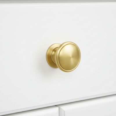 Cosmas 4702BB Brushed Brass Cabinet Knob on white kitchen cabinet drawer