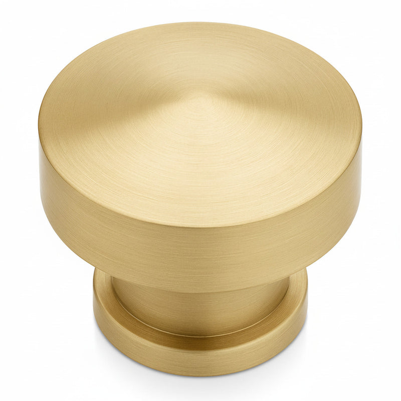 Cosmas 704BB Brushed Brass Round Contemporary Cabinet Knob on a white background