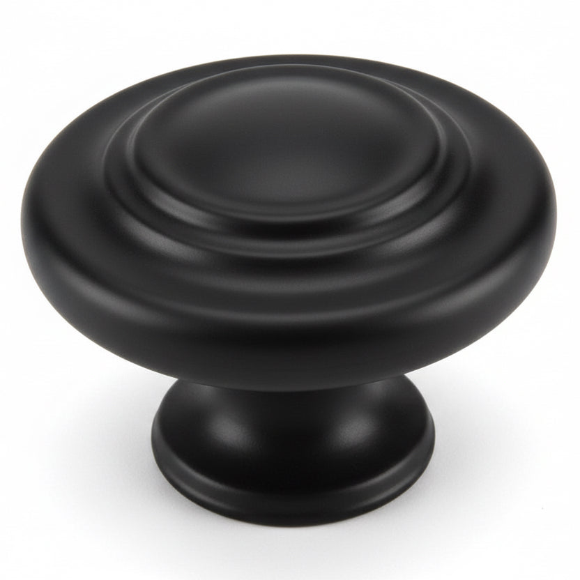 Black cabinet knob on a white background