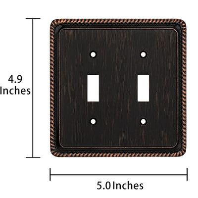 A double toggle switch plate shown with dimension lines and text indicating 4.9 inches tall by 5.