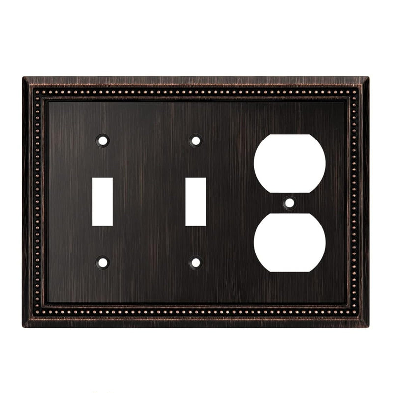 Oil rubbed bronze switch plate with two toggle switches and one outlet on a white background