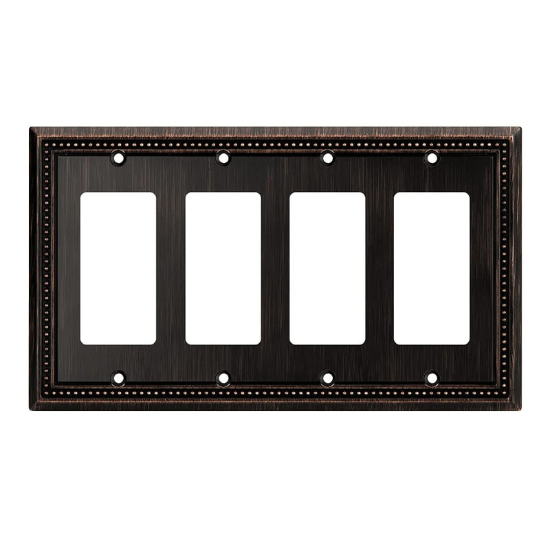 Dark bronze decorative wall plate with four blank sockets on a white background