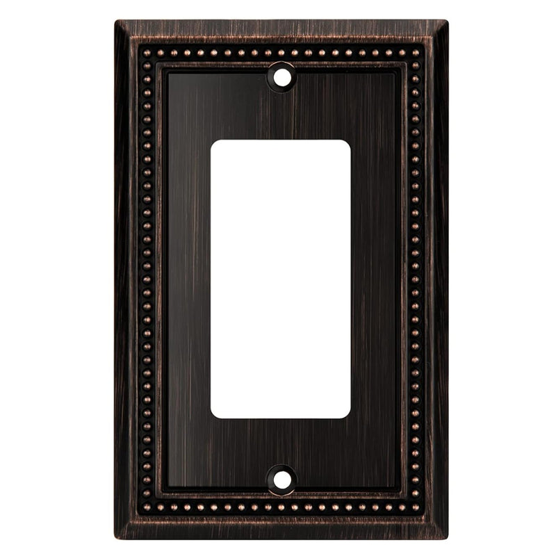 Decorative oil rubbed bronze wall plate with a single gang design on a white background
