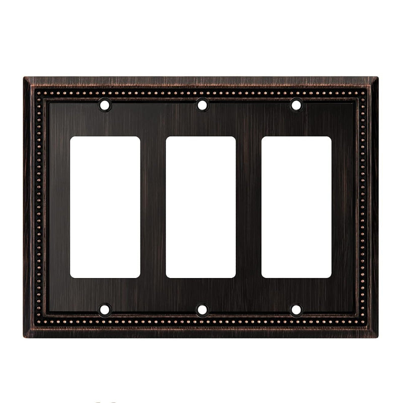 Dark bronze three-gang wall plate with white inserts on a white background