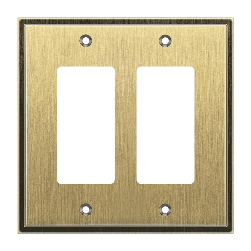 Double gang brass wall plate with two vacant slots on a white background