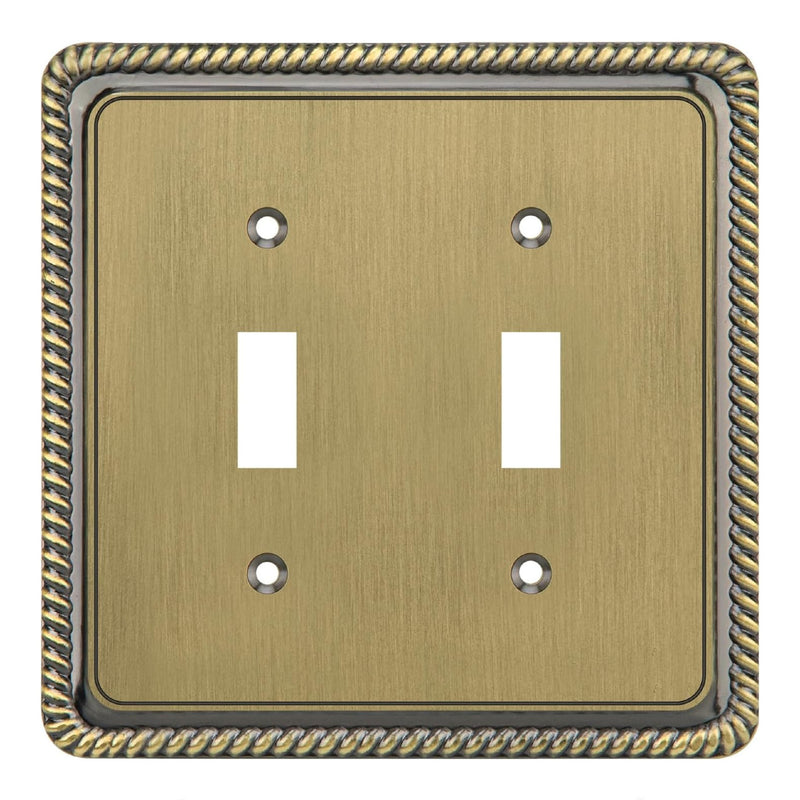Double toggle switch plate with decorative border in brass color
