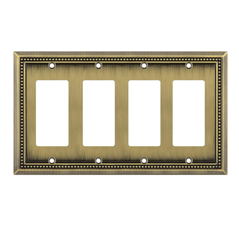 Antique brass four-gang wall plate on a white background