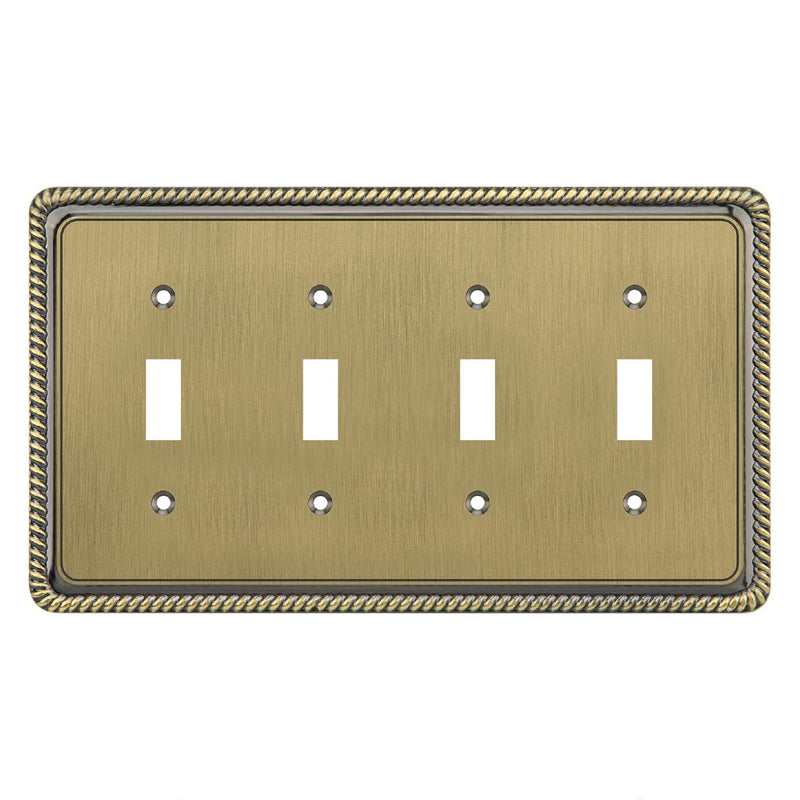 Brass-colored four-toggle switch plate with decorative border on a white background
