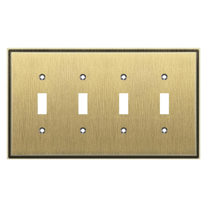 Antique brass switch plate with four toggle switches on a white background