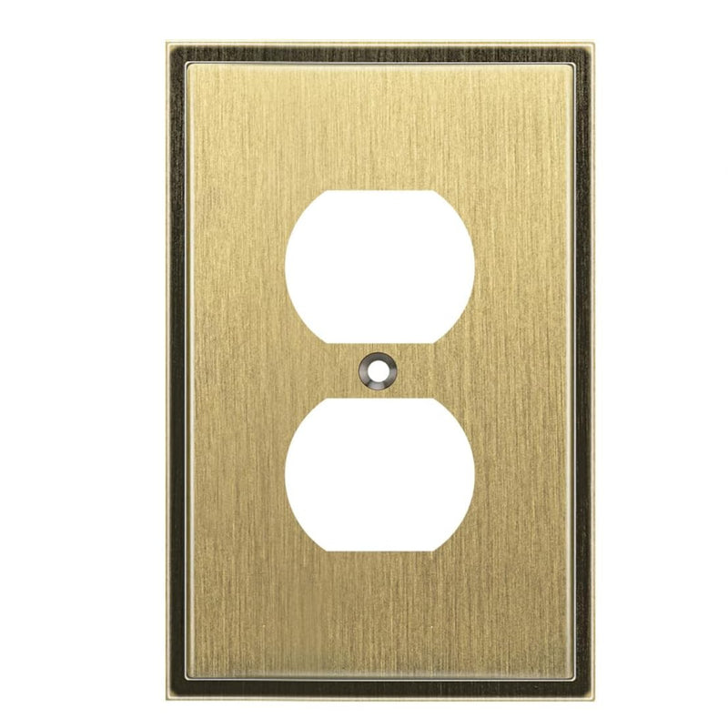 Antique brass wall outlet cover with two sockets on a white background