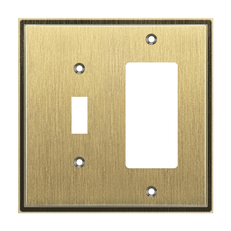 Antique brass switch plate with two outlets on a white background