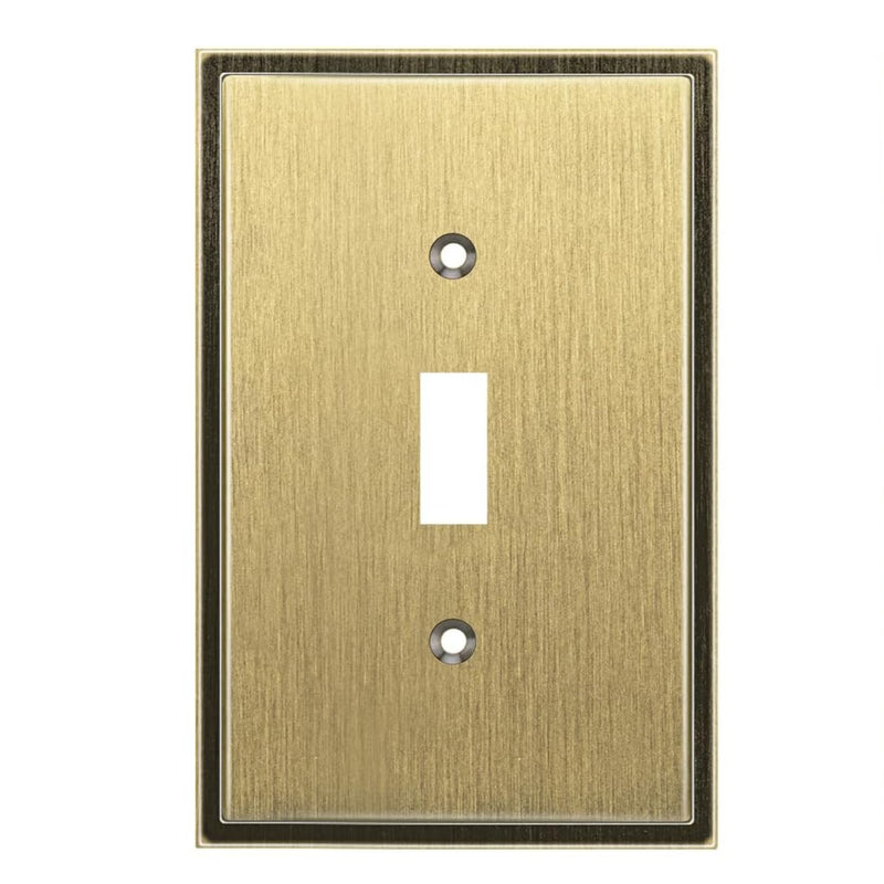 Antique brass switch plate with a single toggle design on a white background