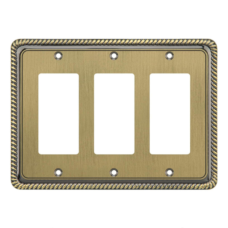 Decorative brass wall plate with three vacant slots on a white background