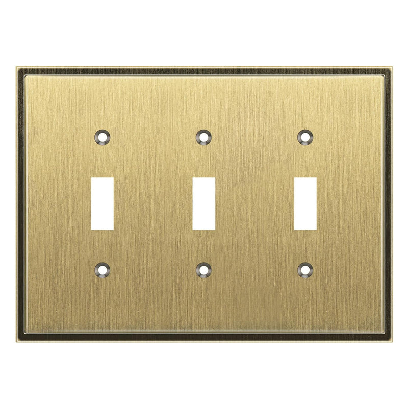 Antique brass triple toggle switch plate on a white background