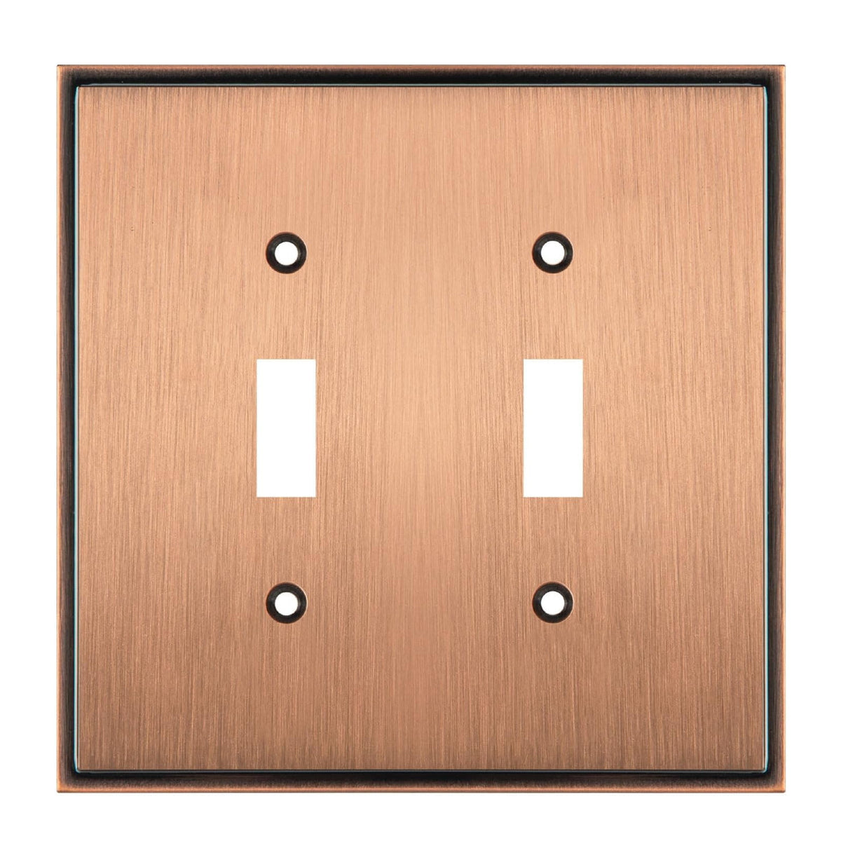 Copper double toggle switch plate with two white switches on a white background