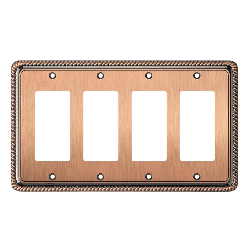 Antique copper electrical wall plate with four sockets on a white background