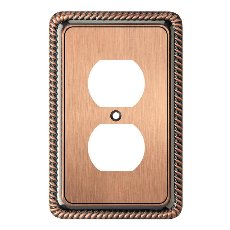 Copper-colored electrical outlet cover with decorative border on a white background