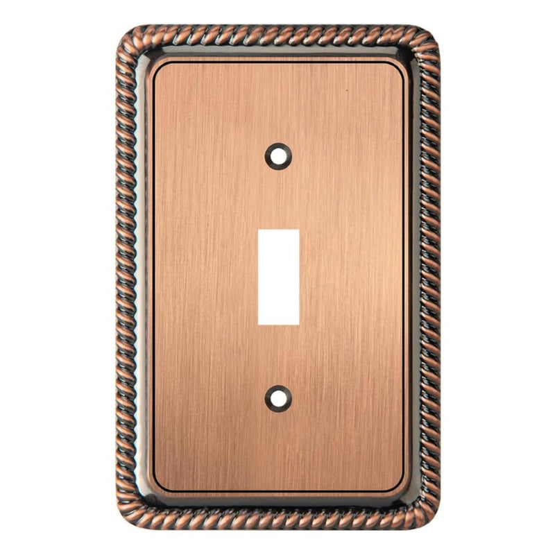 Copper-colored switch plate with decorative border on a white background