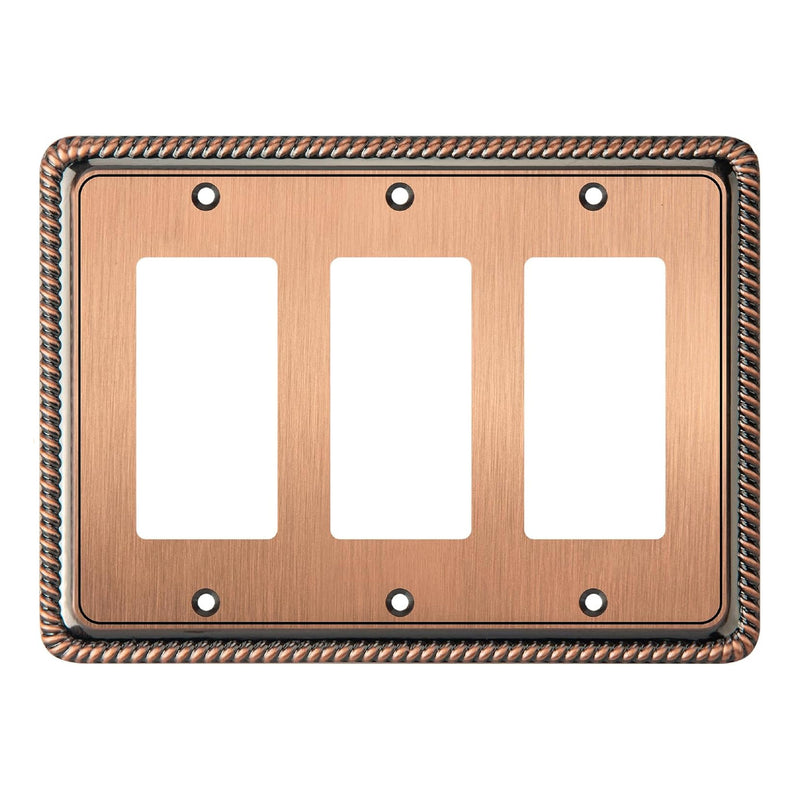 Antique copper triple gang switch plate with decorative border on a white background