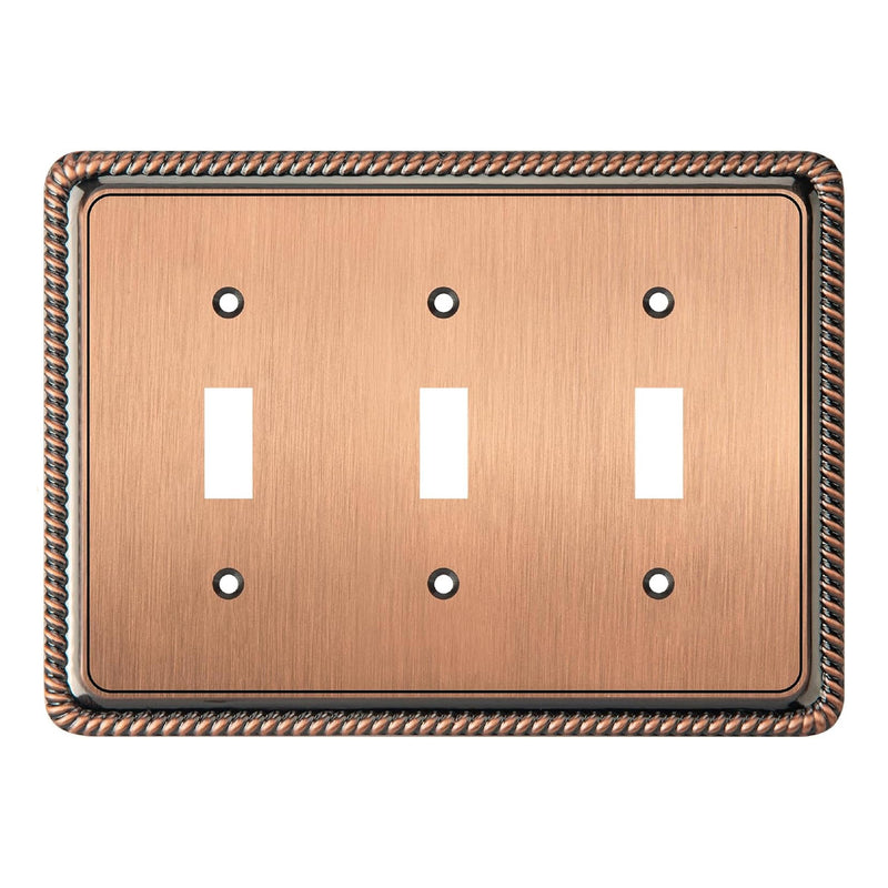 Antique copper triple switch plate with decorative border on a white background