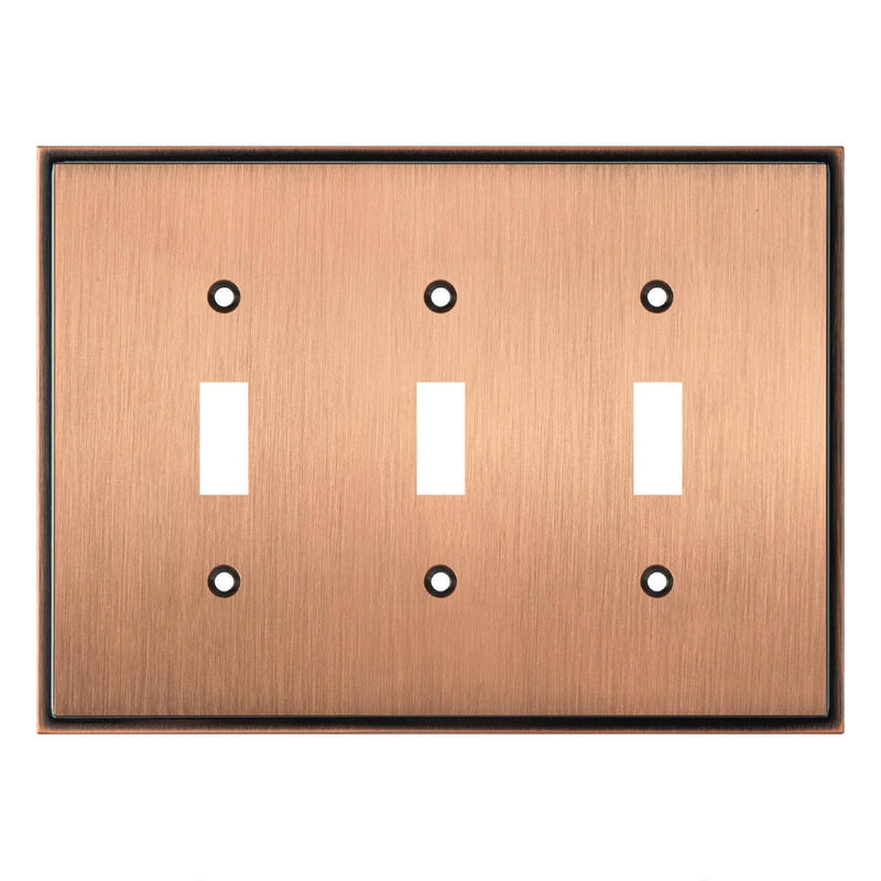 Triple toggle switch plate with a brushed copper finish on a white background