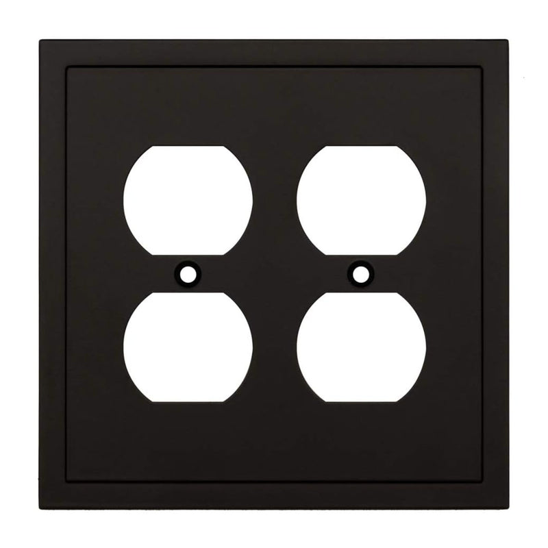 Black electrical outlet cover with white sockets on a white background