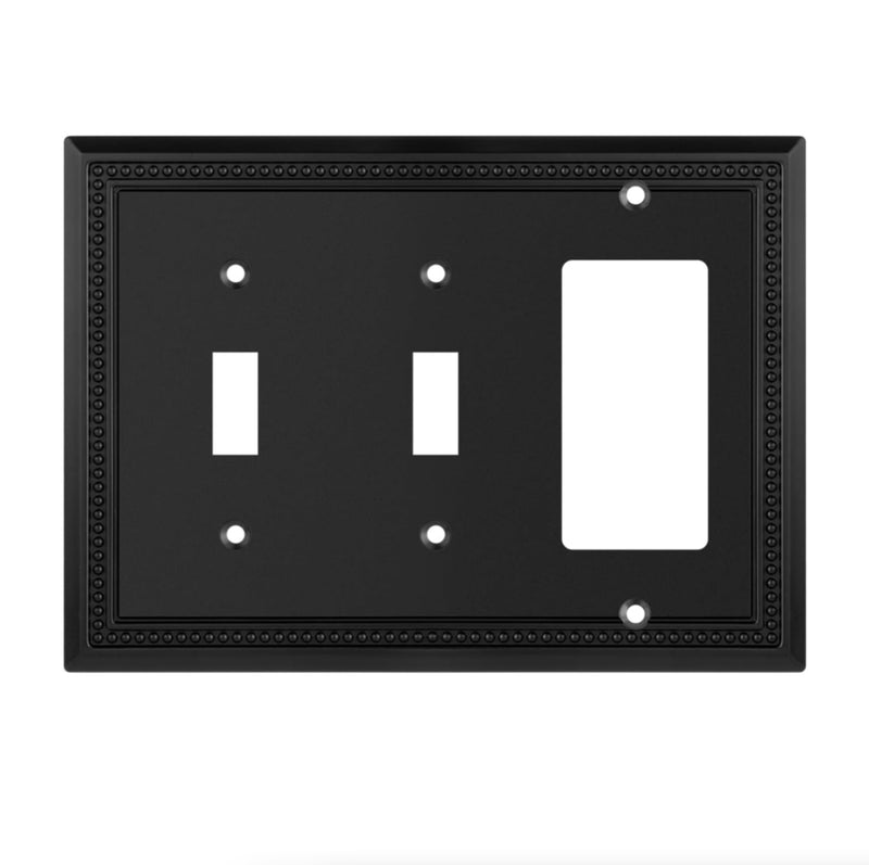 Black switch plate with two toggle switches and a rocker switch on a white background