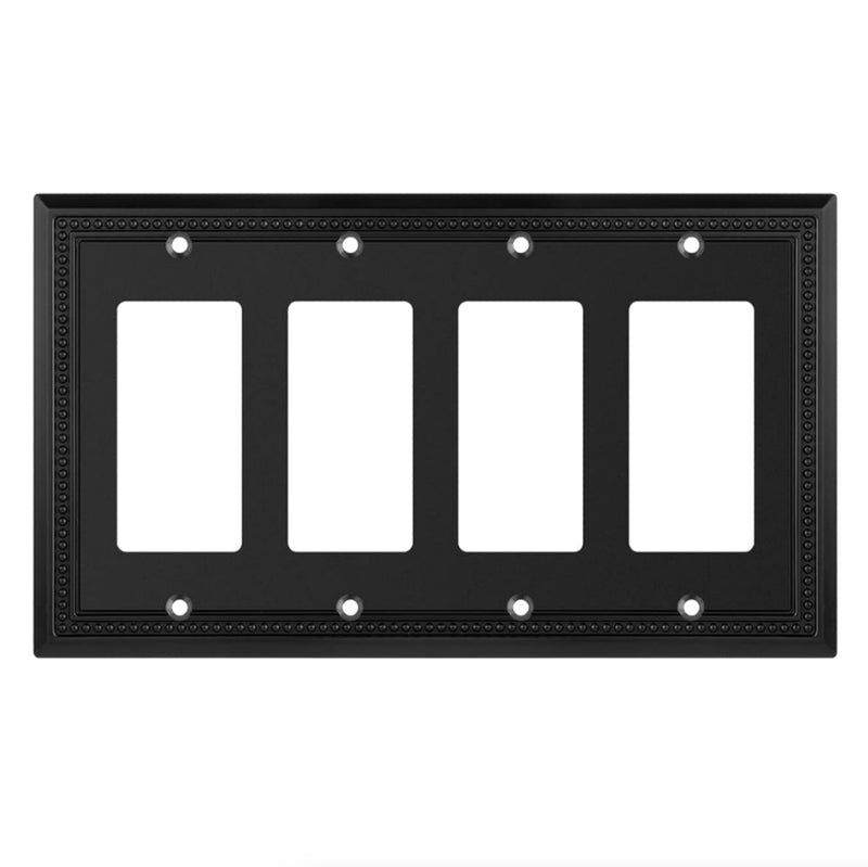 Black decorative wall plate with four blank sockets on a white background