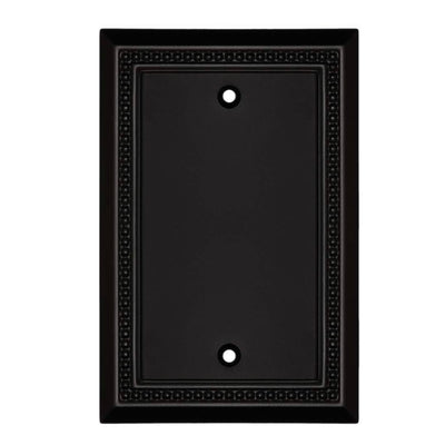 Black wall plate with decorative border on a white background