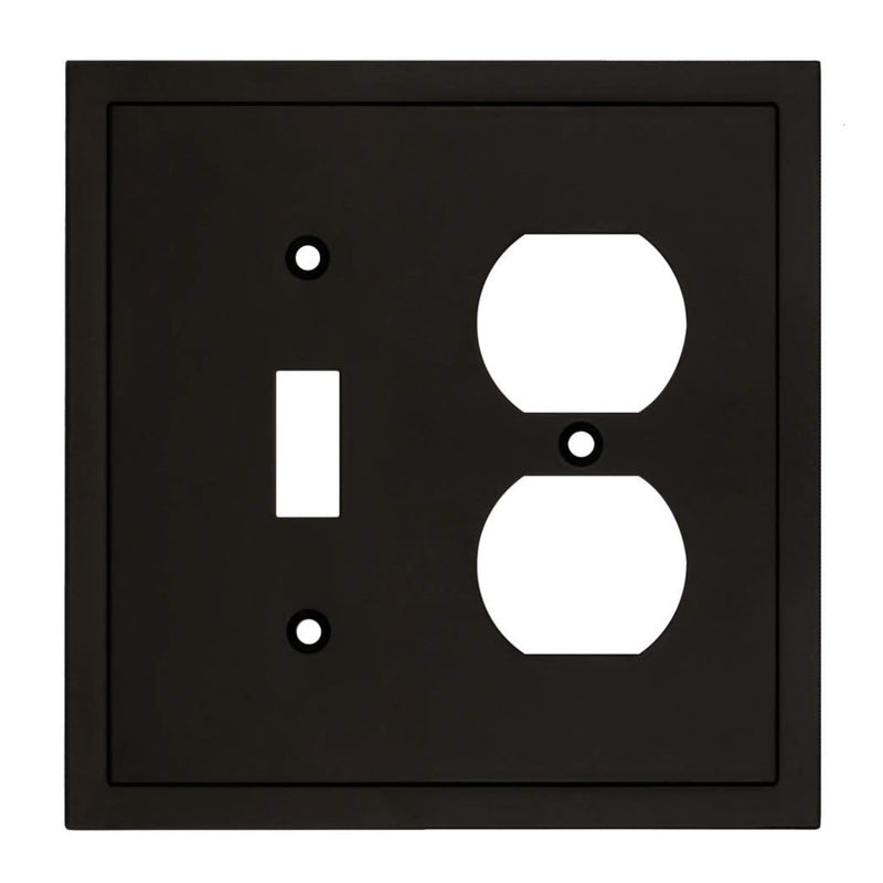 Black wall plate with white switch and outlet symbols on a white background