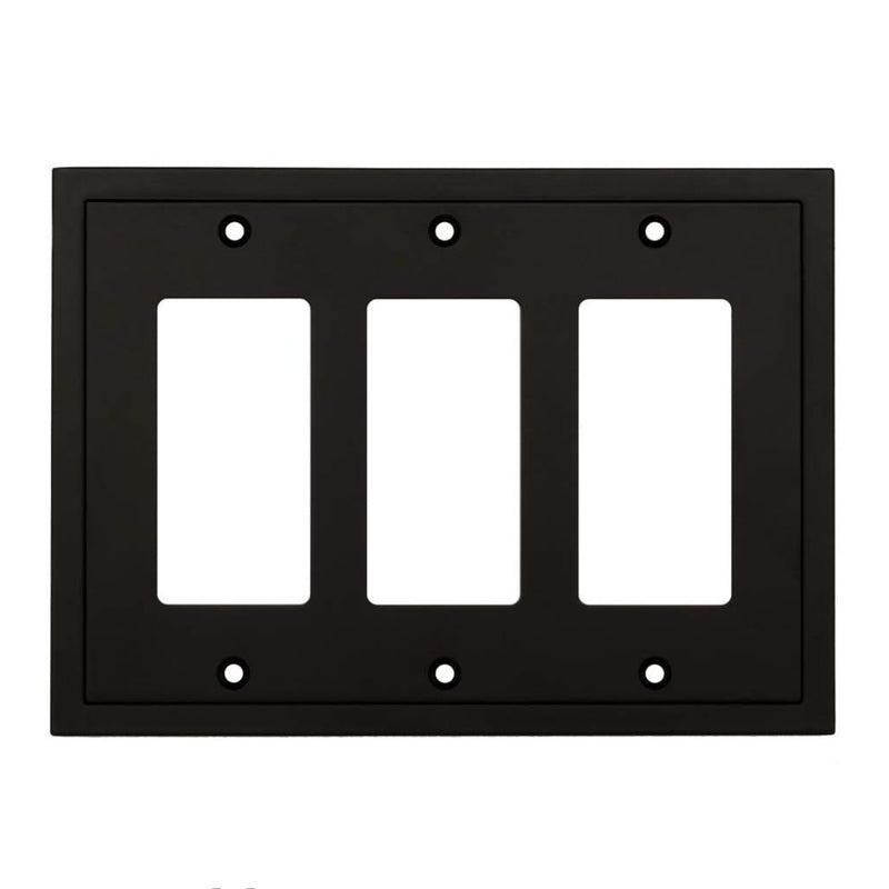 Black three-gang wall plate with white inserts on a white background