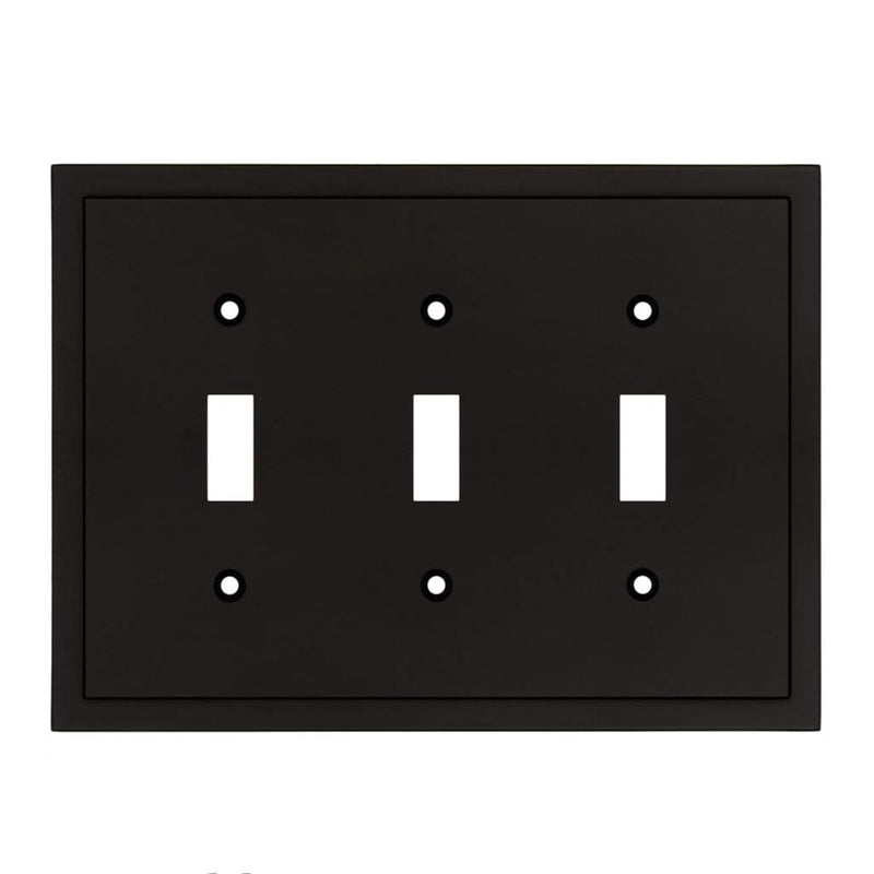 Black three-toggle switch plate on a white background