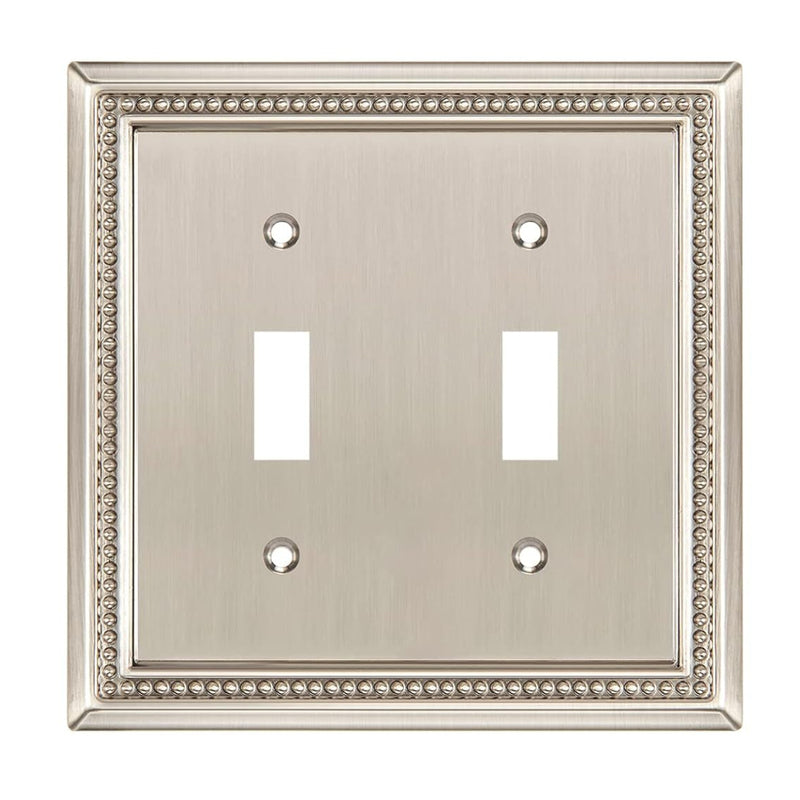 Double toggle switch plate with decorative border on a white background