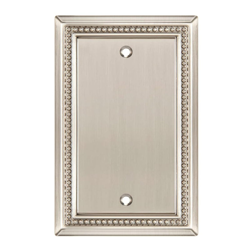 Decorative metal wall plate with beaded border on a white background