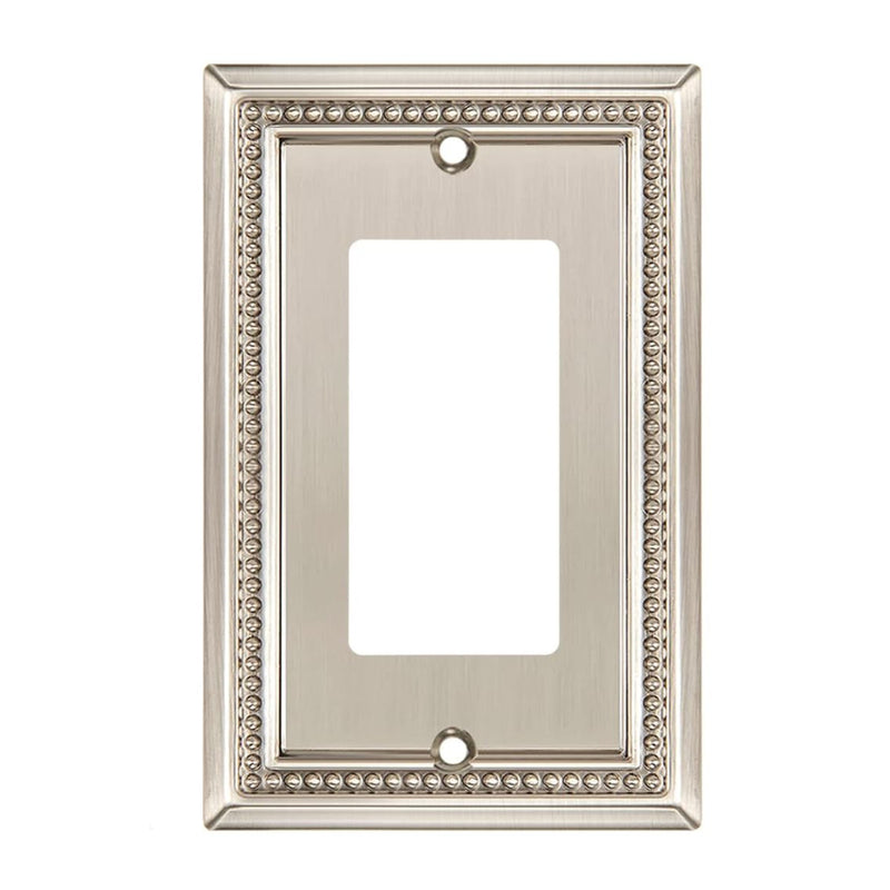 Decorative light switch cover with ornate border on a white background