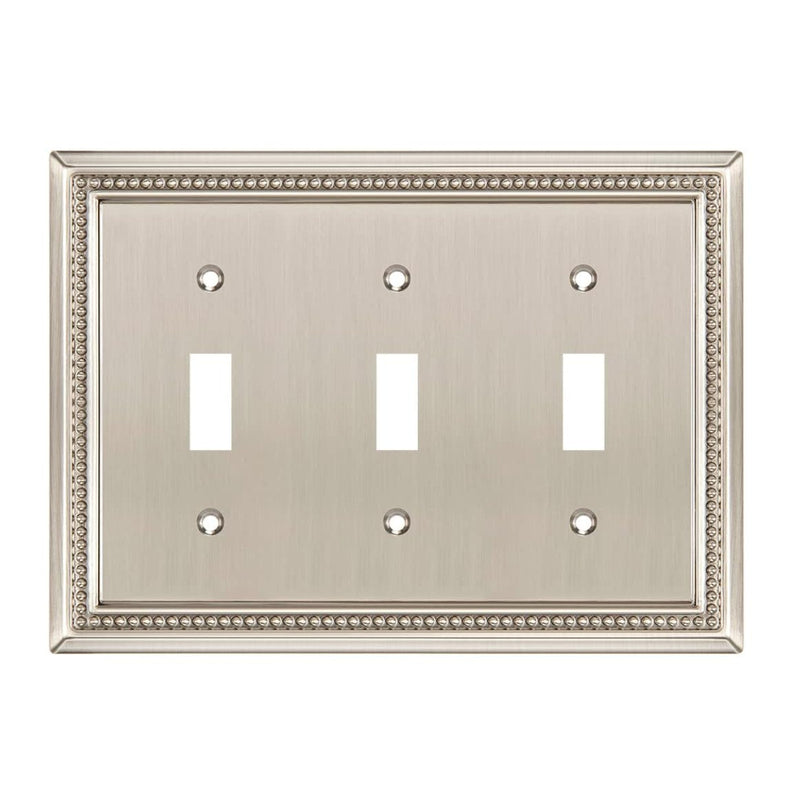 Triple toggle switch plate with decorative border on a white background