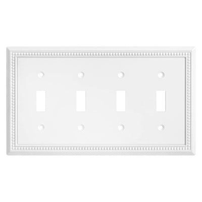 White quad toggle switch wall plate with decorative border on a white background
