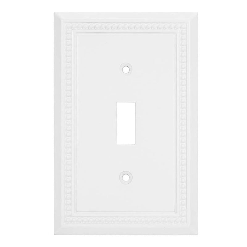 White wall switch plate with decorative border on a white background